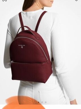 Michael Kors burgundy pebbled leather backpack
